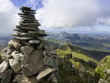 View over landscape with cairn to foreground